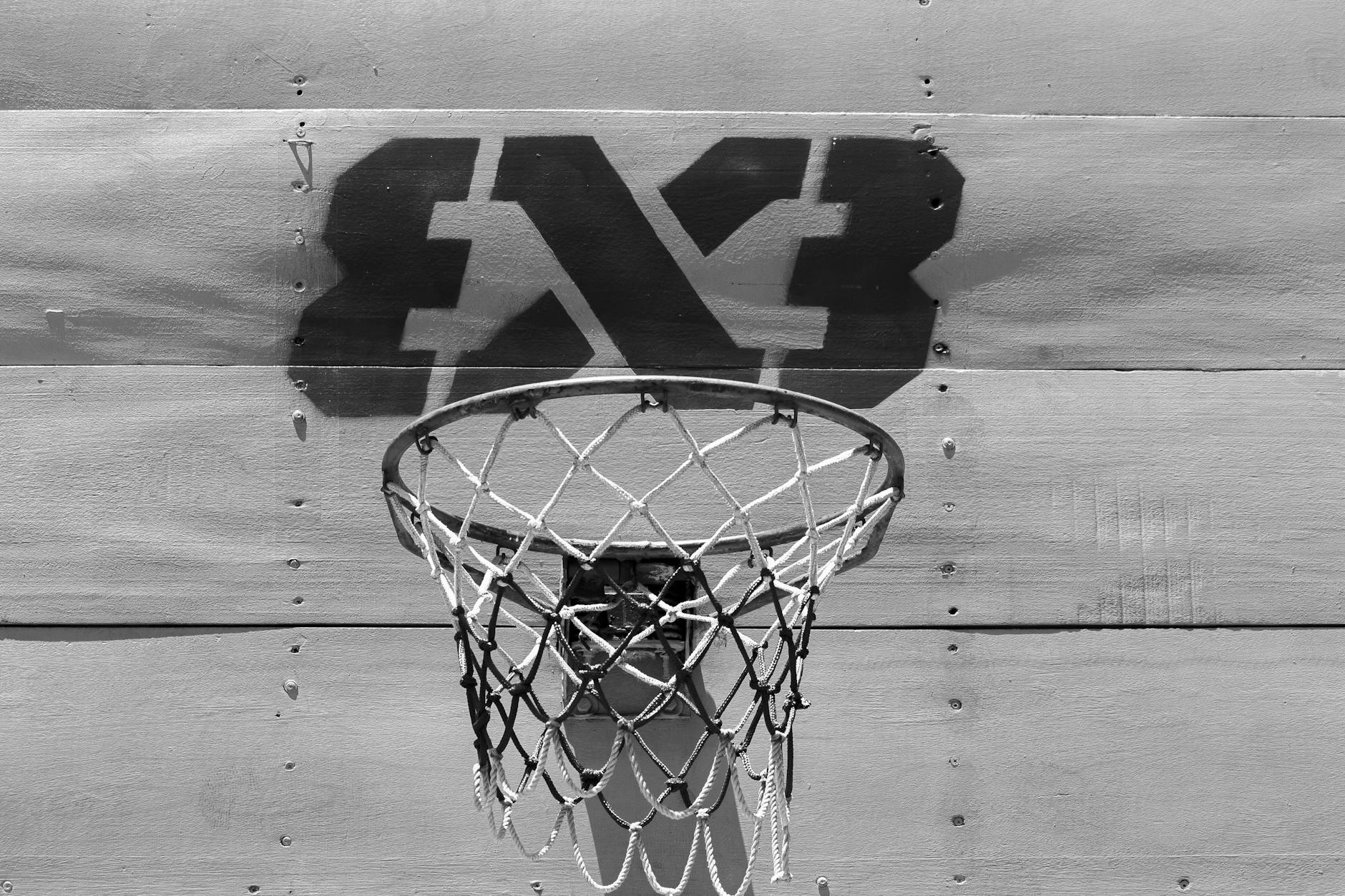 grayscale photo of a basketball ring