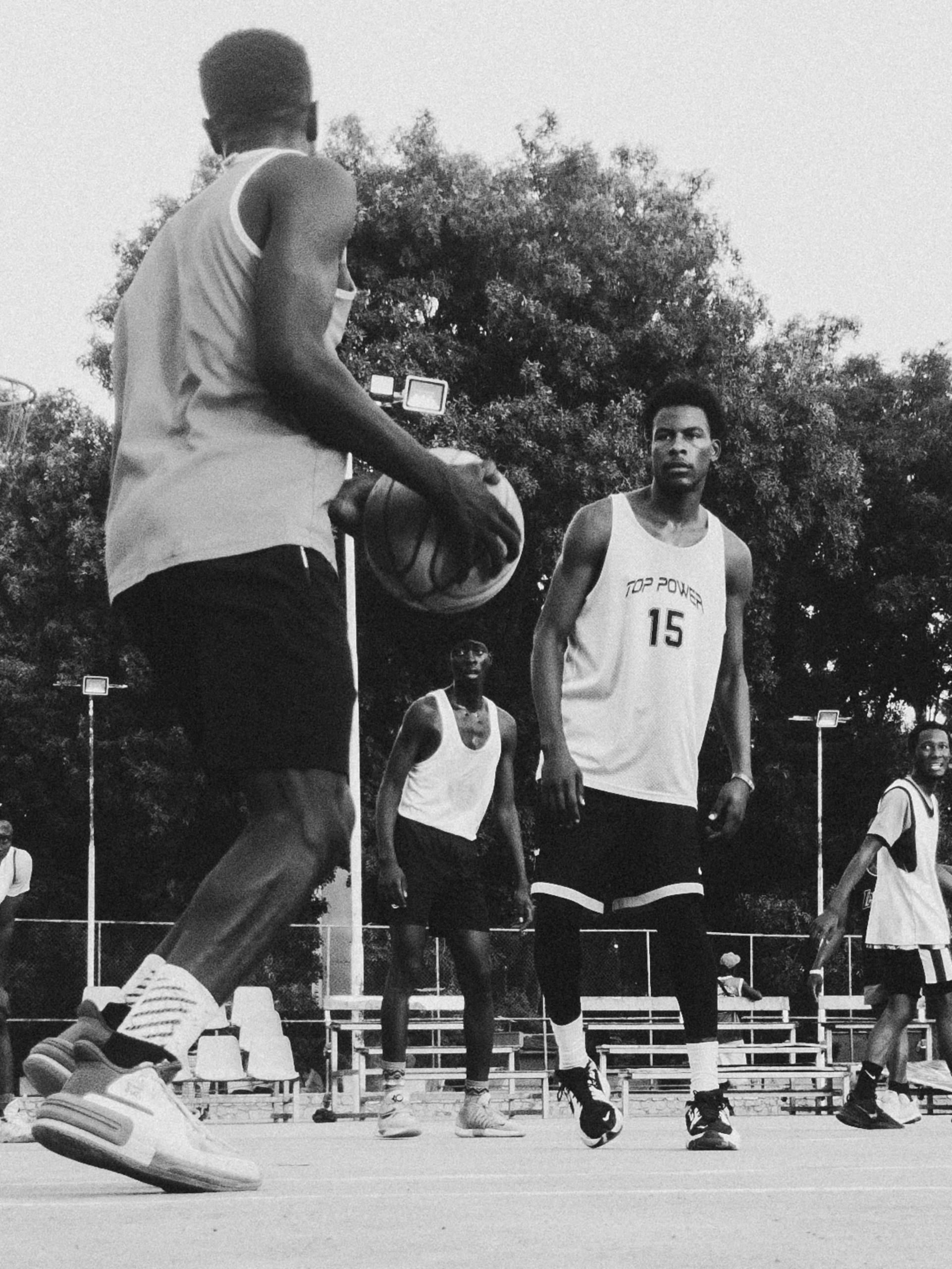 Vibrant street art depicting cartoonish faces and fish on an urban wall.
